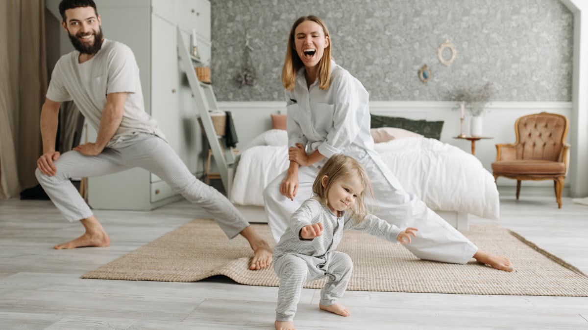 A joyful family engaging in morning stretches together, fostering a fun and healthy routine.
